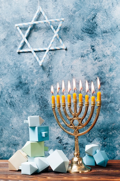 Free Photo traditional hanukkah candles on a table