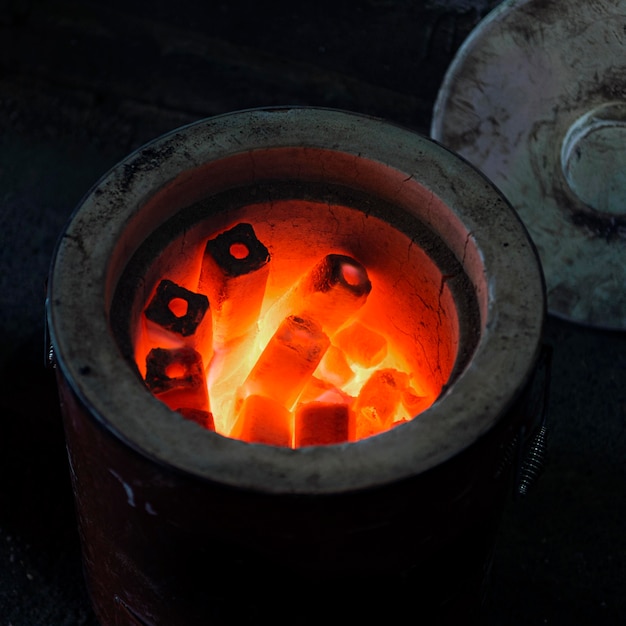 Free photo traditional japanese coal stove heating up