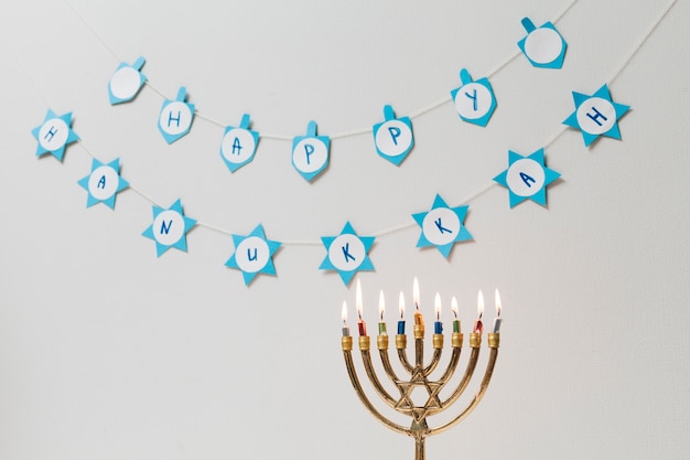 Free Photo traditional jewish menorah with candles