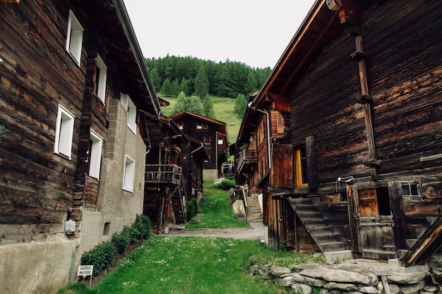 Traditional Swiss village with old wooden houses in Alps