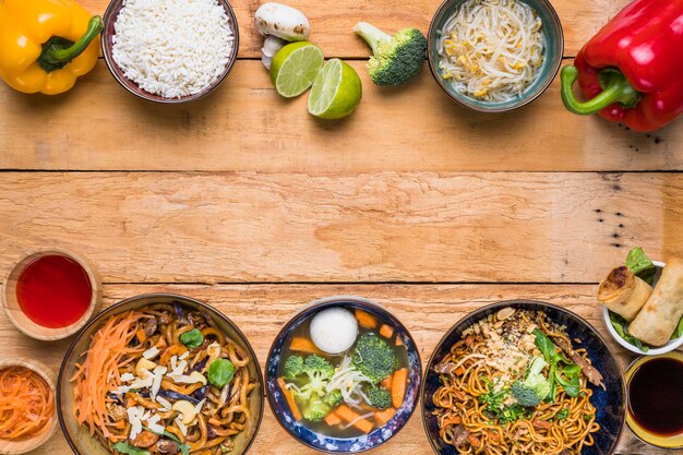 Traditional thai food on the bottom and top wooden desk