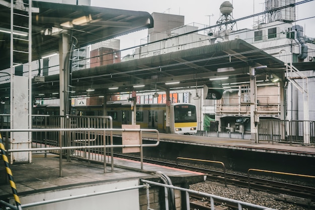 Free Photo train arriving at the station in the city