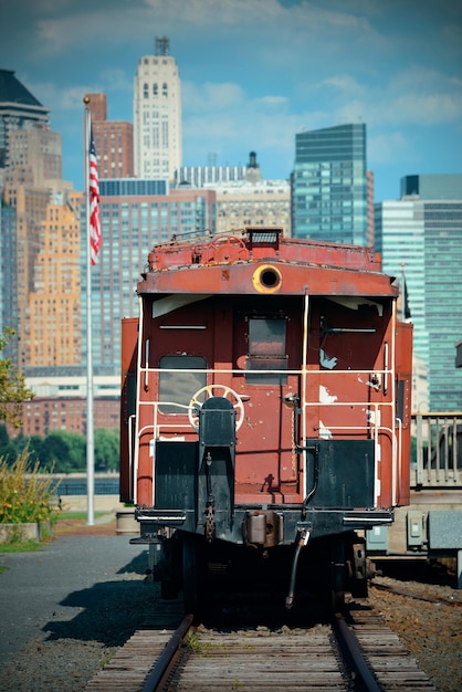 Train and downtown Manhattan in park.