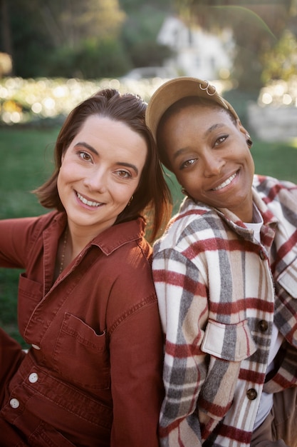 Trans couple being happy and smiling while having a picnic at the park