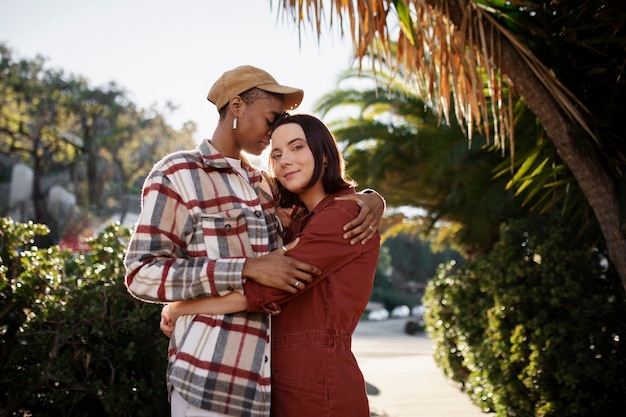 Trans couple hugging each other and smiling