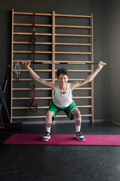 Trans man working out and exercising at the gym