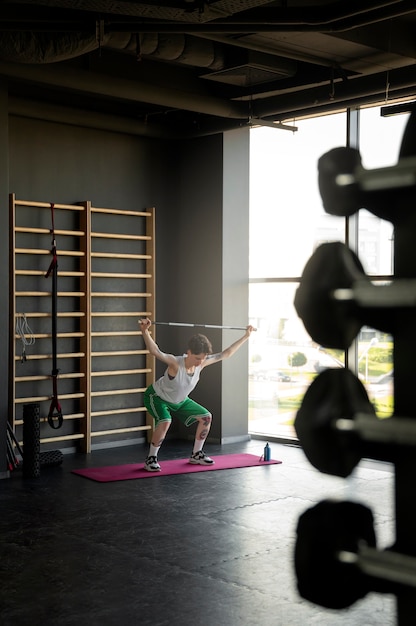 Trans man working out and exercising at the gym