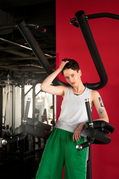 Trans man working out and exercising at the gym