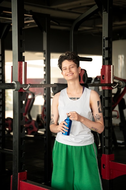 Trans man working out and exercising at the gym