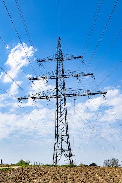 Free photo transmission tower with a clear blue sky