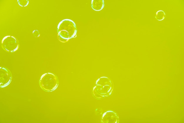 Transparent bubbles over green background