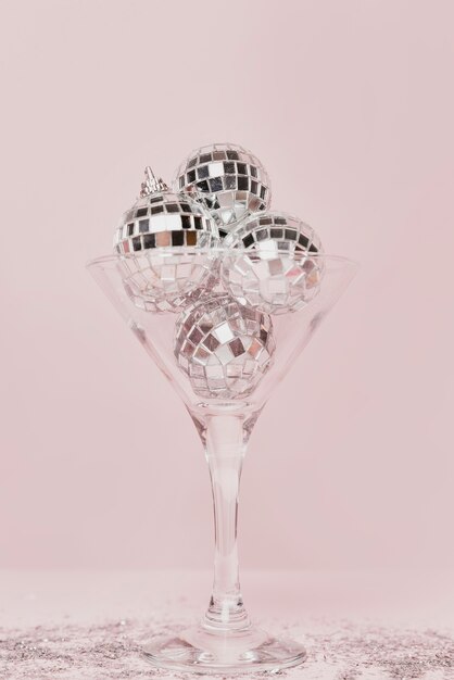 Transparent champagne glass with silver balls