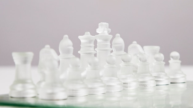 Free Photo transparent chess pieces on board