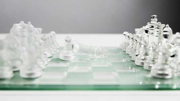 Transparent chess pieces on board