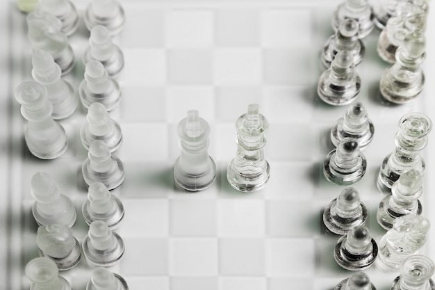 Free Photo transparent chess pieces on board