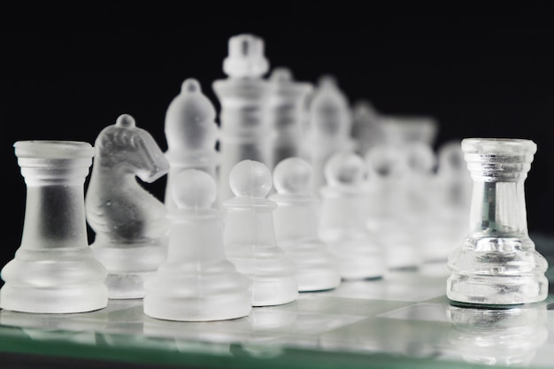 Transparent chess pieces on board