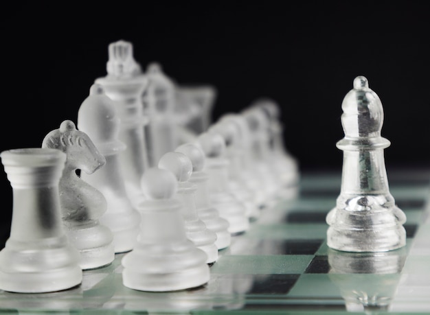 Free Photo transparent chess pieces on board