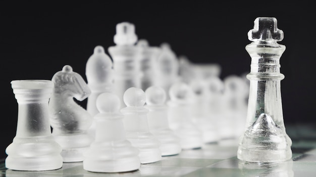 Transparent chess pieces on board