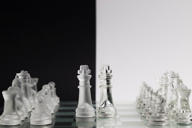 Free photo transparent chess pieces on board