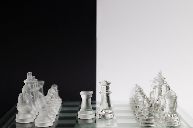 Free photo transparent chess pieces on board