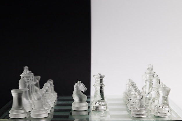 Transparent chess pieces on board