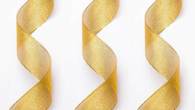 Free Photo transparent golden ribbons in background