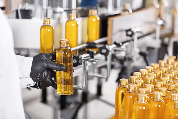 Transparent plastic bottles filled with yellow substance