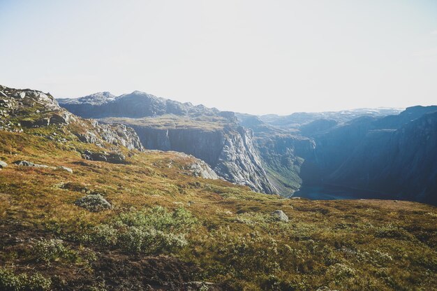 Travel around Norwegian national park at autumn season, hiking in mountains.