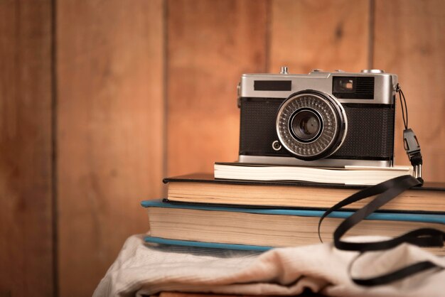 Travel concept with camera on books