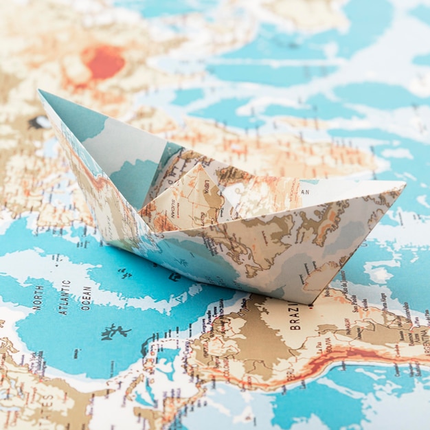 Travel concept with paper boat