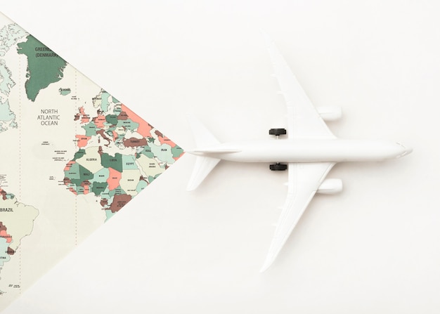 Free photo travel concept with world map and toy plane