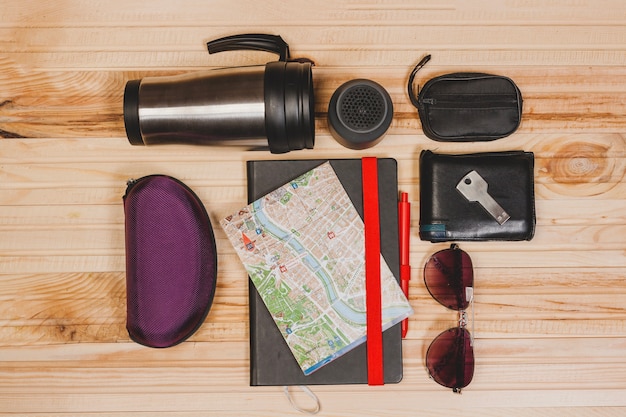 Travel elements on wooden background