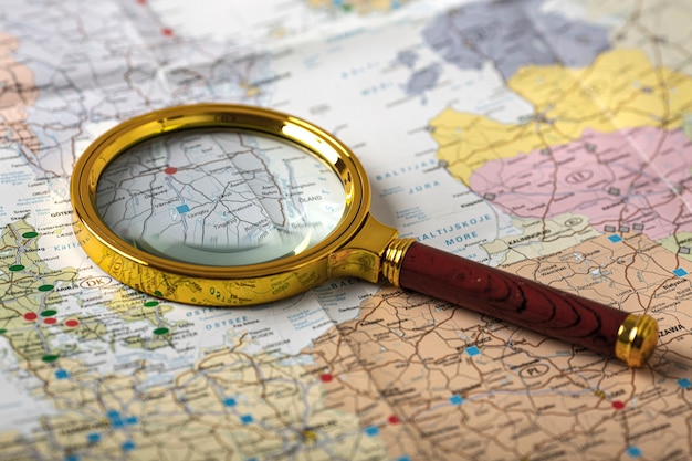 Travel set with magnifying glass on map