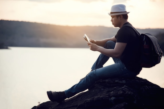 Travel Young man at the sunset