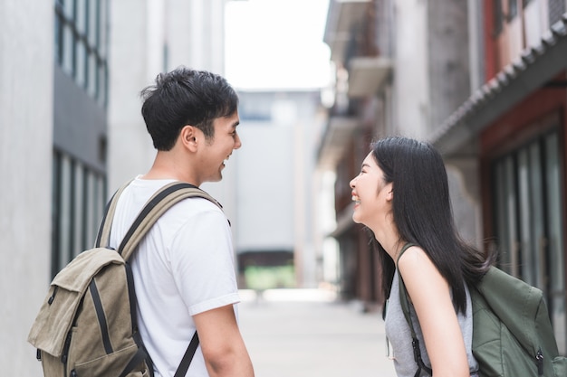 Traveler Asian backpacker couple feeling happy traveling in Beijing, China