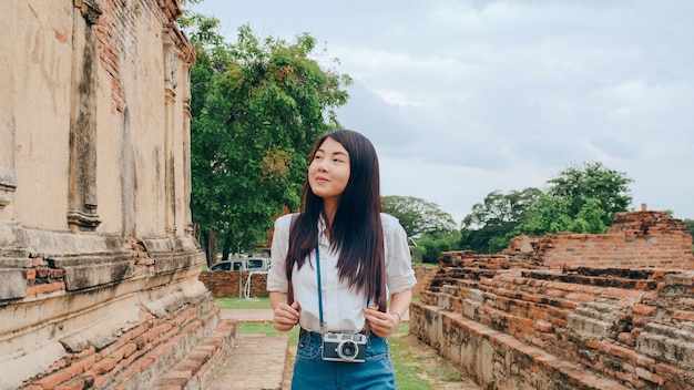 Traveler Asian woman spending holiday trip at Ayutthaya, Thailand