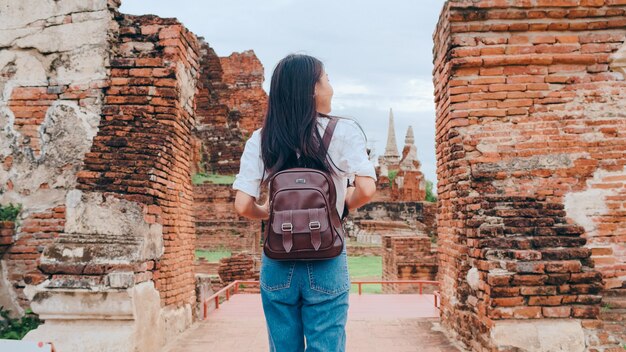 Traveler Asian woman spending holiday trip at Ayutthaya, Thailand