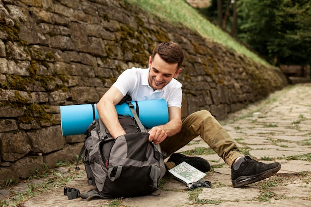 Traveler making his backpack