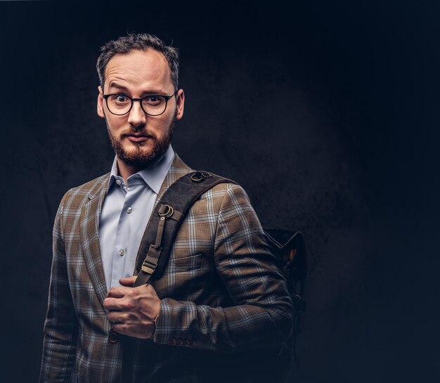 Traveler. Studio portrait of a handsome bearded man wearing a ca