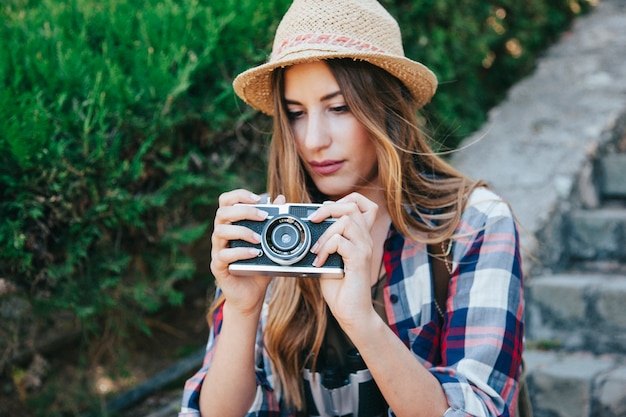 Traveler with camera in the park