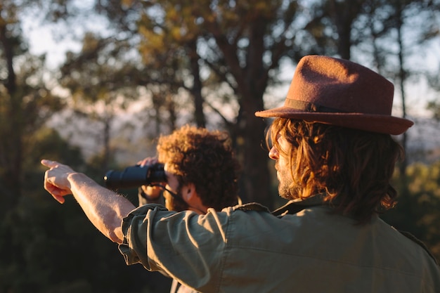 Free Photo travelers looking into distance