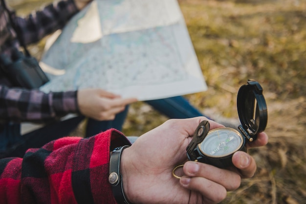 Travelers with compass and map