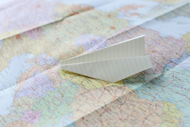 Free photo traveling map and paper plane