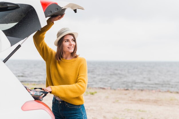 Traveling woman taking her backpack out