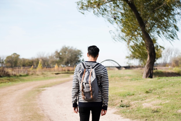 Traveling young man on the road