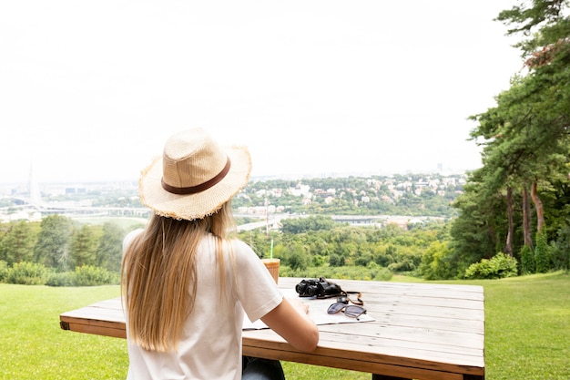 Traveller at the bench from behind