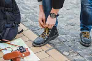 Free photo traveller tightening laces