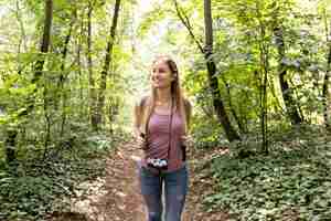 Free photo traveller in woods looking away