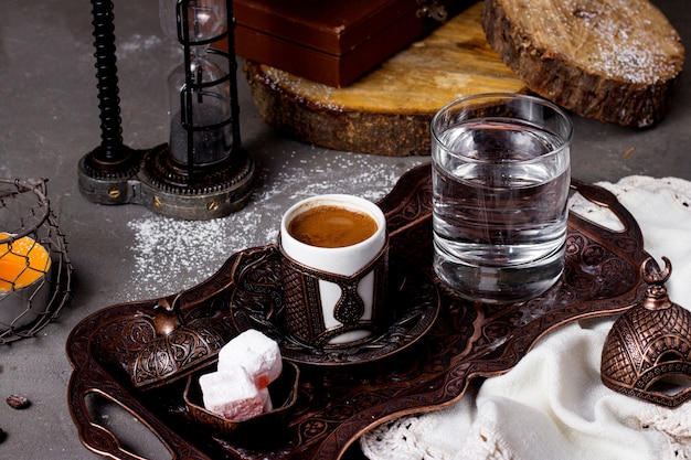 Tray with hot turkish coffee water and lokum