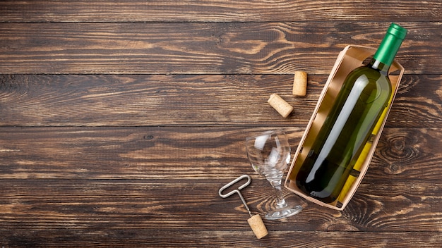 Tray with wine bottle and stoppers beside